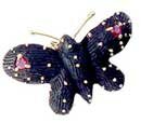 borboleta em coco, ouro e rubis - J�ias Raras
